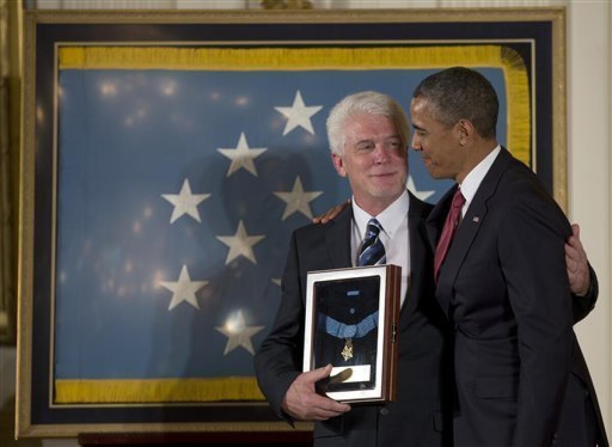 President Obama with Ray Kapaun, nephew of Korean War era Army Chaplain Emil J. Kapaun, who received the Medal of Honor posthumously for extraordinary heroism.