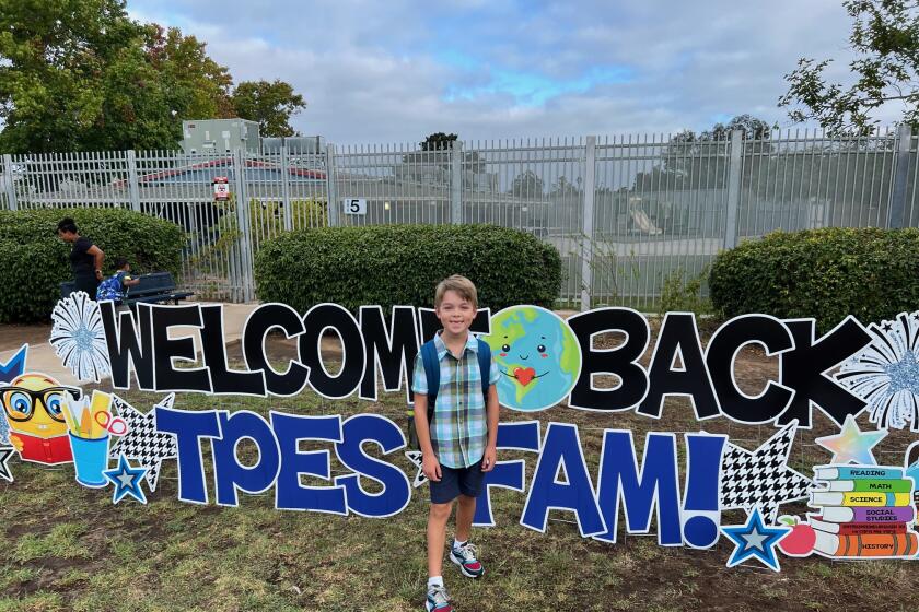 Second-grader Calvin Szotko is ready for his first day back at La Jolla's Torrey Pines Elementary School on Aug. 29.
