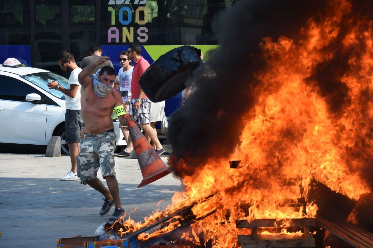 French taxi drivers protest in the southern city of Marseille as they demonstrate against Uber, which is facing fierce opposition from traditional cabs.