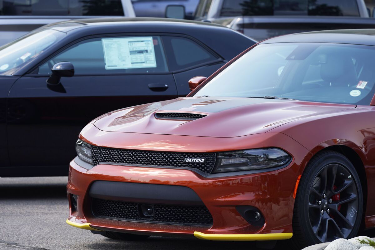 An unsold 2020 Charger sedan sits at a Dodge dealership, Sunday, Sept. 6, 2020, in Littleton, Colo. The best thing you can do for your car’s value is to take care of it. (AP Photo/David Zalubowski)