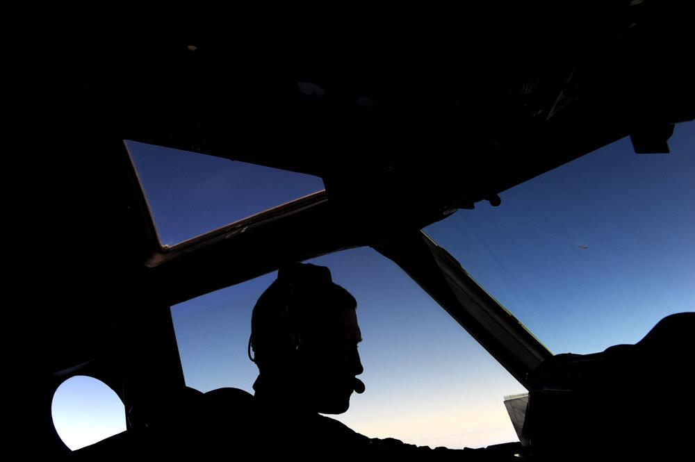Lieutenant Timothy McAlevey of the Royal New Zealand Airforce pilots the P-3K2-Orion aircraft during the search for missing Malaysia Airlines Flight MH370 over the Indian Ocean on April 13.