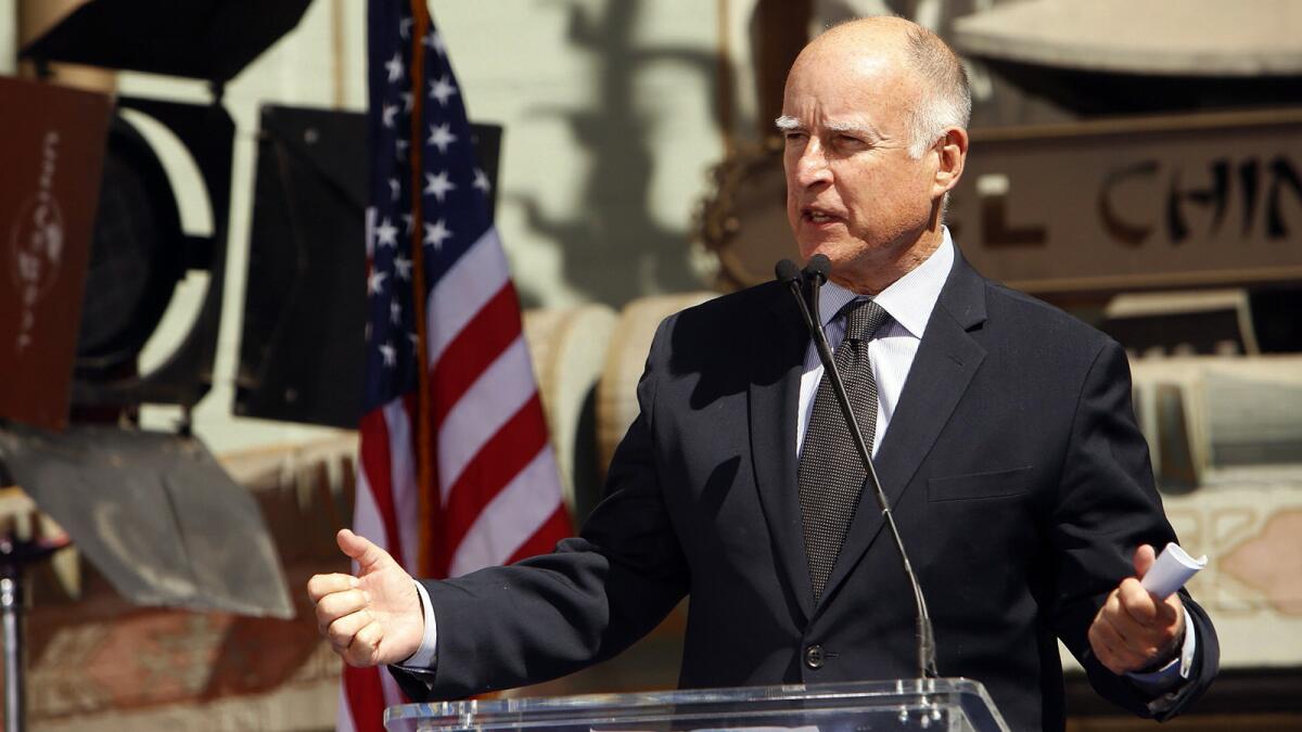 One of the measures signed by California Gov. Jerry Brown, shown earlier this month, authorizes wiretaps for the investigation or prosecution of human trafficking.