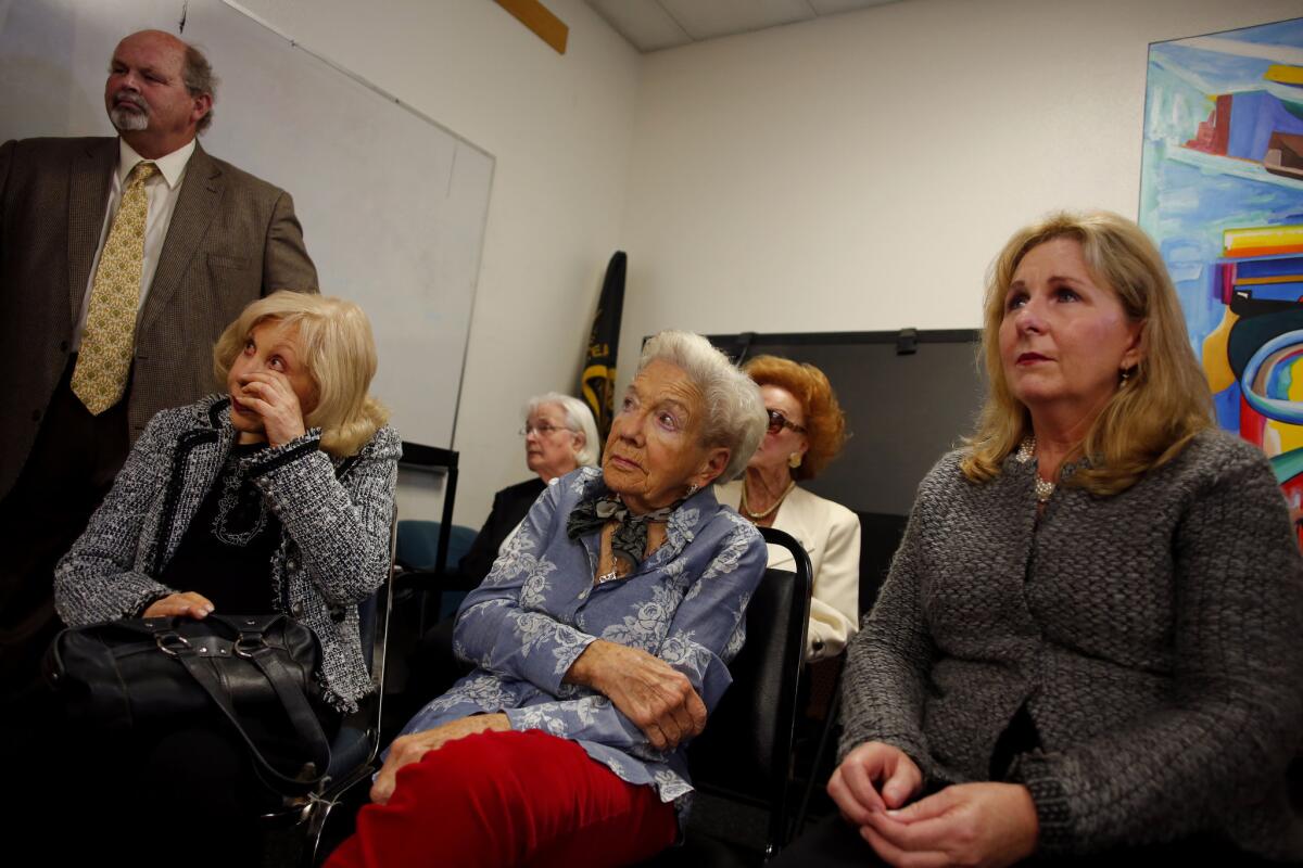 Mary Toolen-Roskam wipes a tear from her eye during a news conference announcing a $50,000 reward in the slaying of Antonia Yager. Roskam is pictured with Joyce Skinner, center, Shar Penfold and some of Yager's other friends.