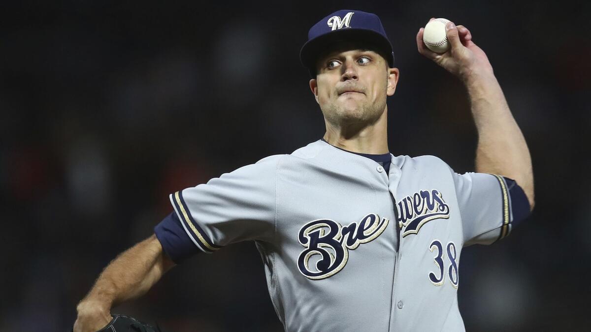 Milwaukee Brewers pitcher Dan Jennings delivers a pitch against the San Francisco Giants in July.