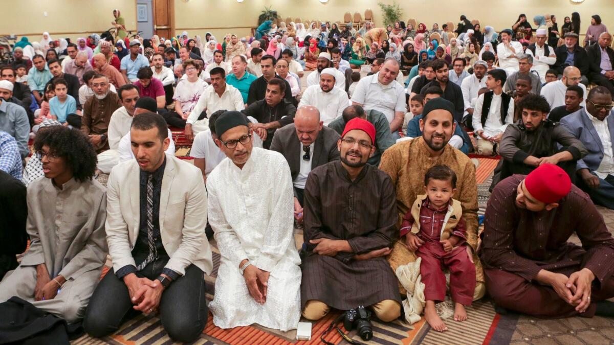 Muslims gathered Sunday to offer Eid al-Fitr prayers organized by the Middle Ground Muslim Center in Upland. Eid al-Fitr is the celebration that marks the end of Ramadan.