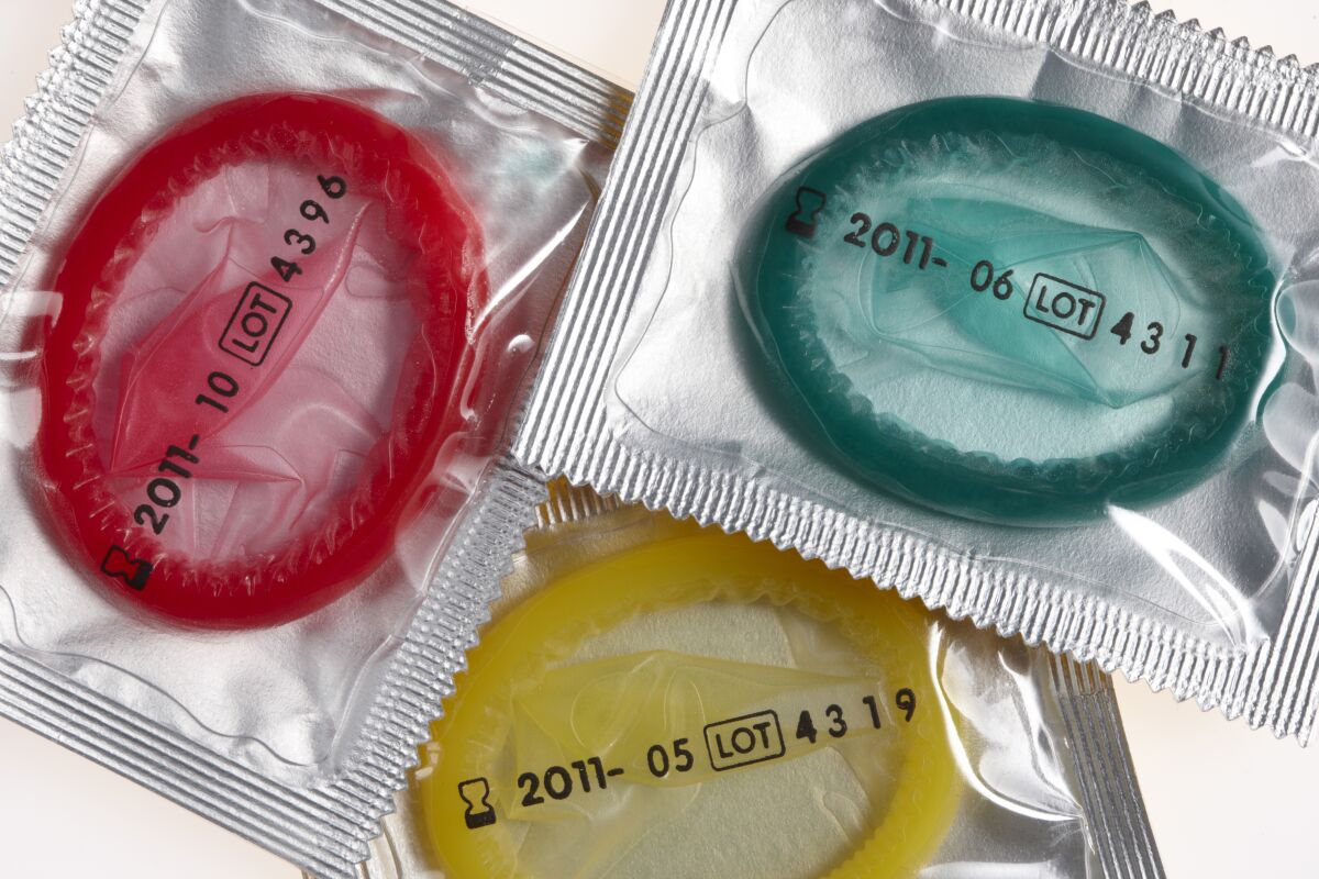 Colorful condoms in sealed wrappers