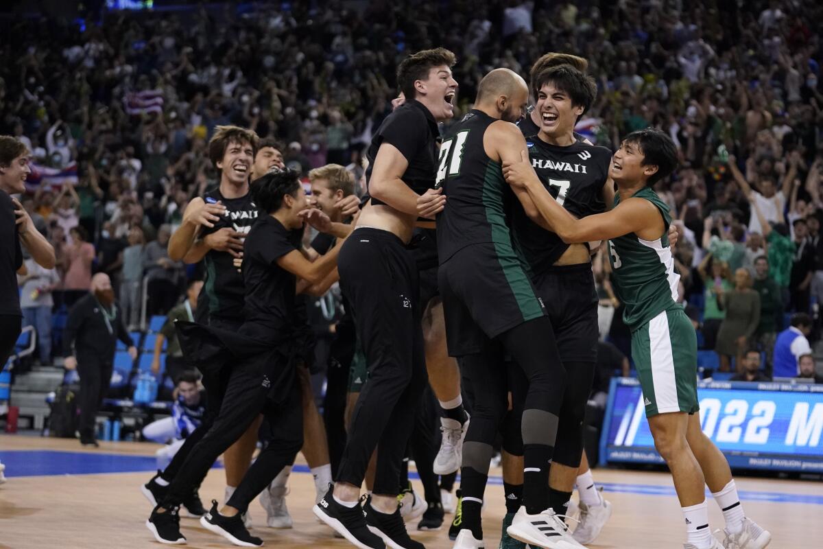 Hawaii players celebrate after beating Long Beach State to win the NCAA men's college volleyball national title May 7, 2022.