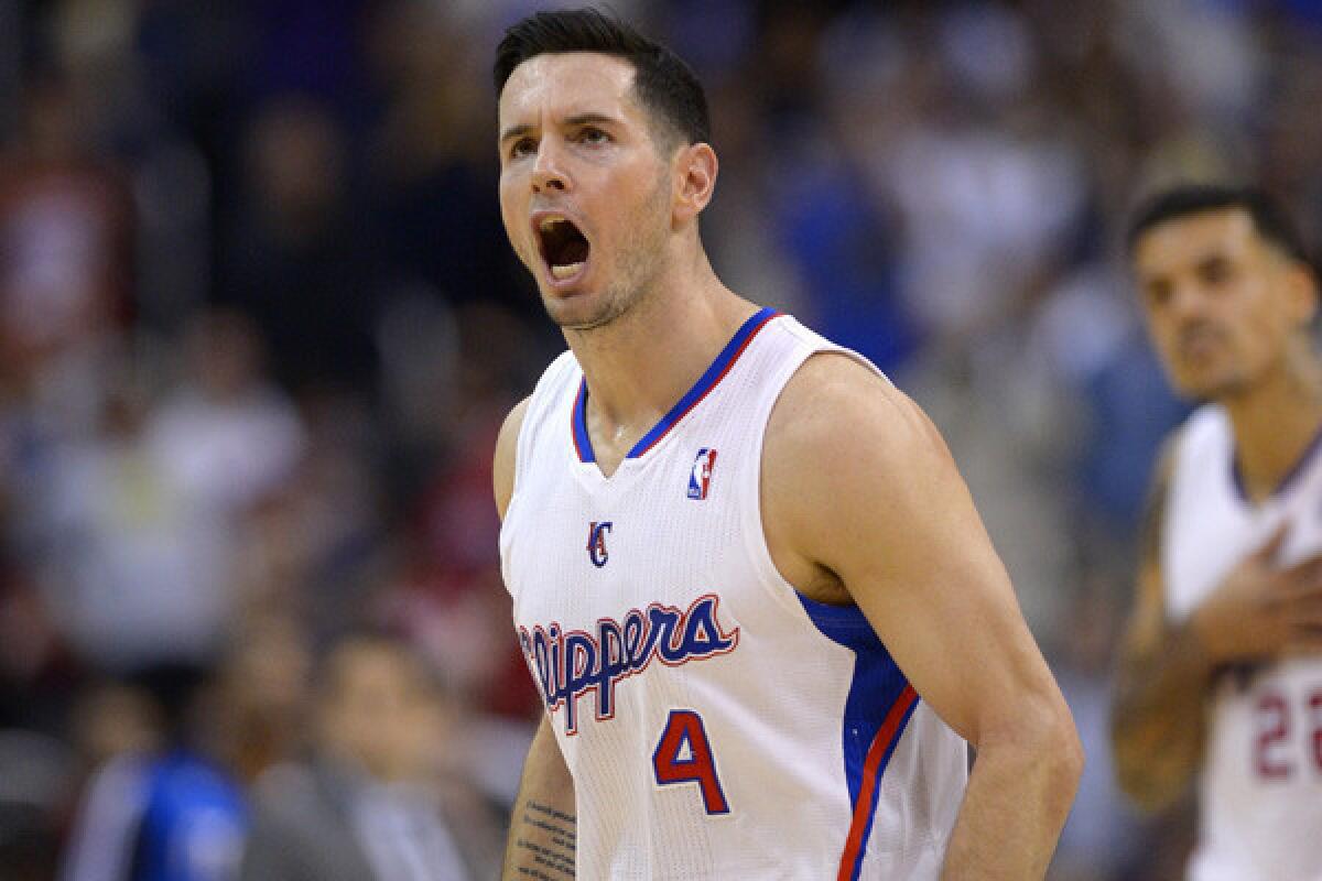 Clippers guard J.J. Redick reacts after hitting a three-point shot against the Dallas Mavericks during a game last month at Staples Center.