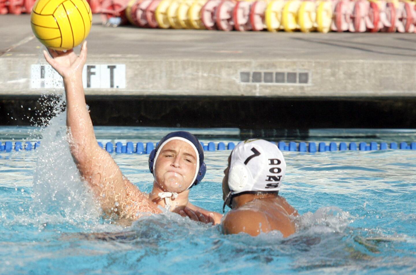 CV's Griffin Harting, left, passes the ball while Cerritos' Michael Hanna defends Harting during a match at PCC on Wednesday, October 3, 2012.