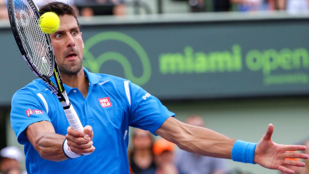 Novak Djokovic volleys a shot during his victory over Kei Nishikori in the Miami Open championship match Sunday.