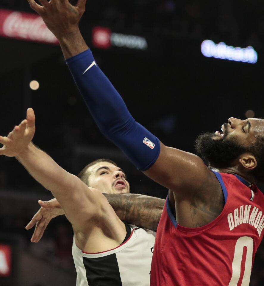 Detroit Pistons center Andre Drummond, right, shoots over Clippers center Ivica Zubac during the second half.