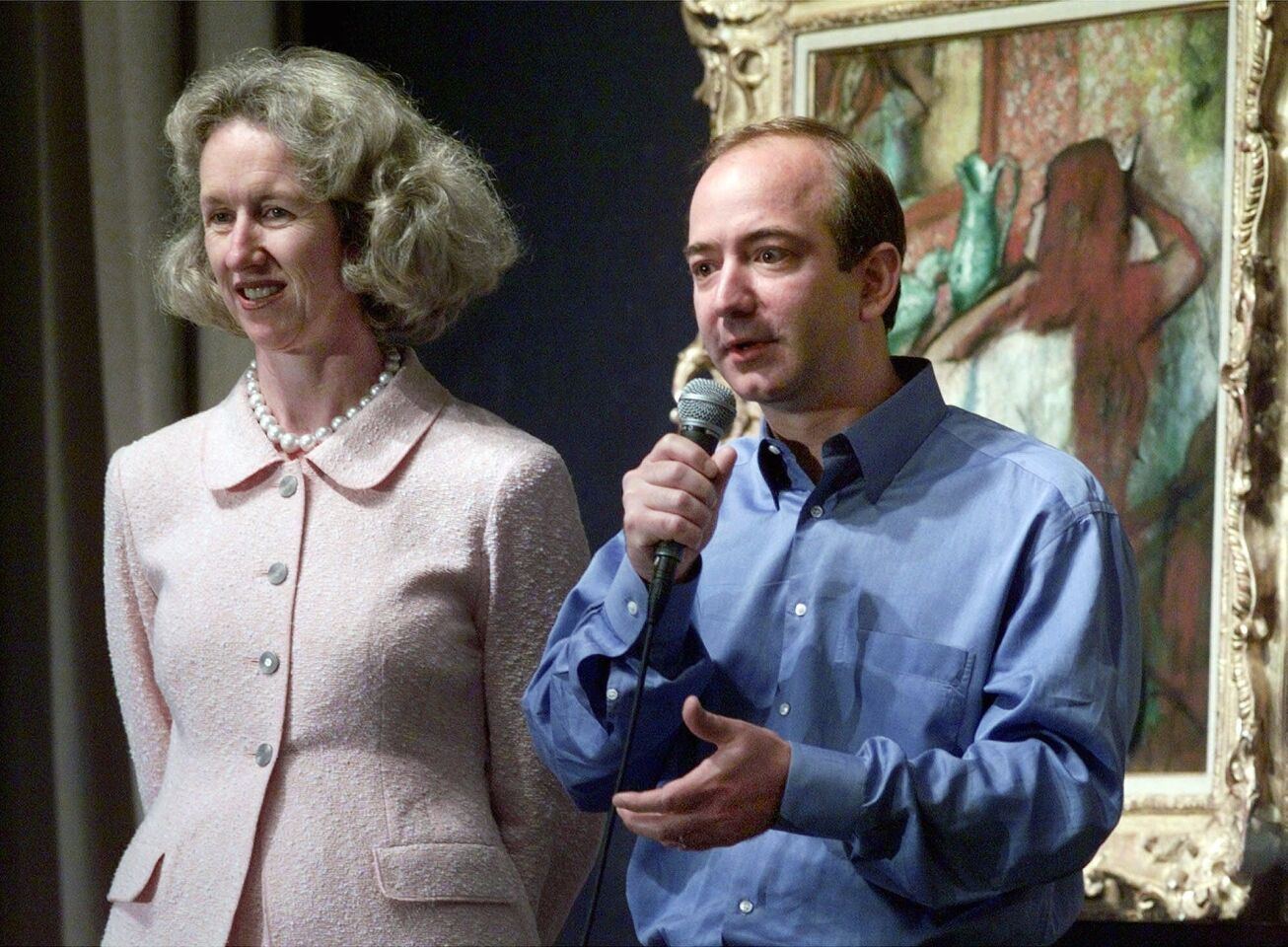 Diana Brooks, left, president and CEO of Sotheby's, and Jeff Bezos, founder and CEO of Amazon.com, Inc., address a news conference at Sotheby's in New York, Wednesday June 16, 1999. Internet superstore Amazon.com invested about $45 million for a 1.7 percent stake in Sotheby's.