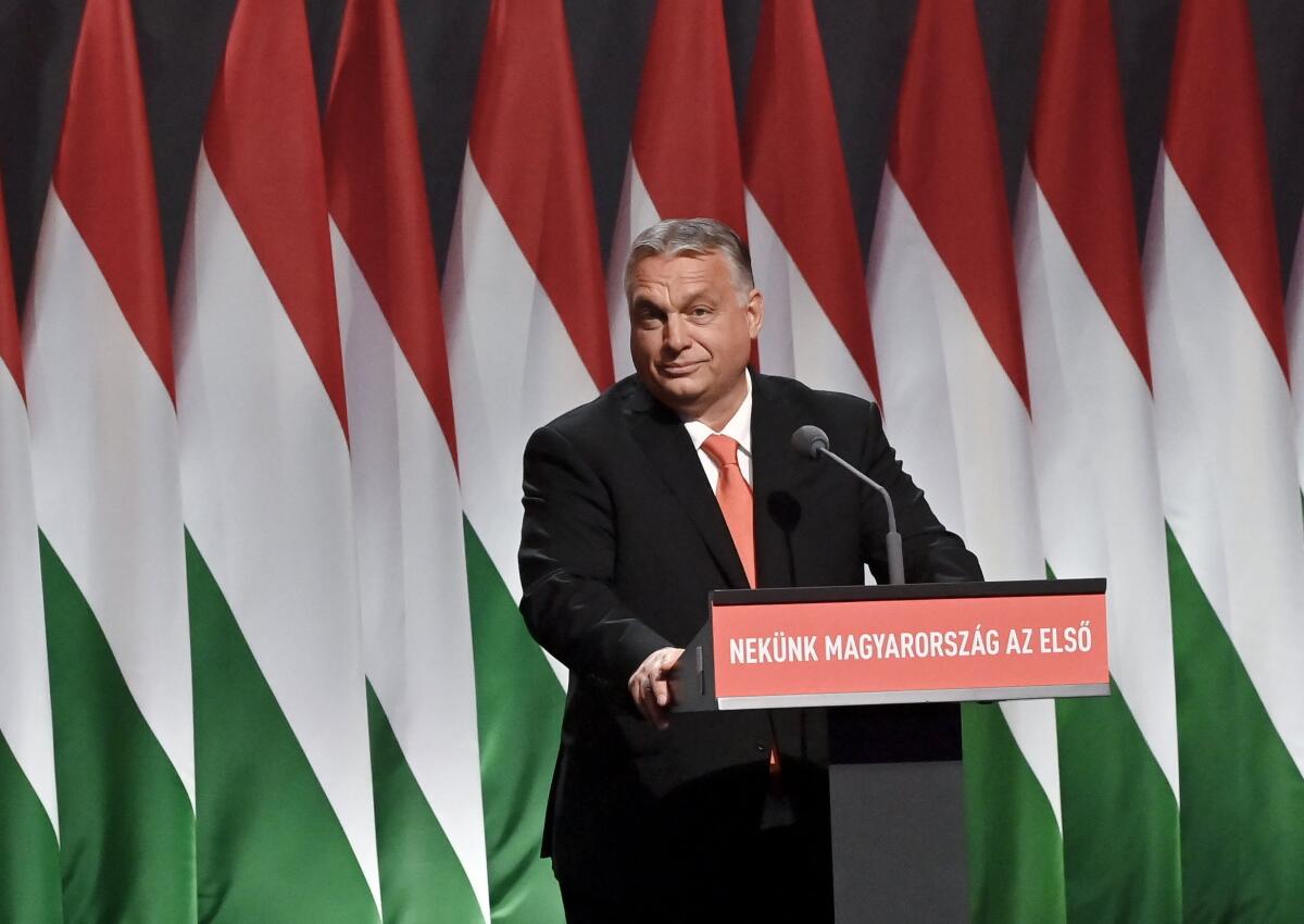 Hungarian Prime Minister Viktor Orban, Chairman of the ruling Hungarian Fidesz party, addresses the 29th congress of Fidesz in Budapest, Hungary, Sunday, Nov. 14, 2021. The inscription reads: "For us Hungary is first". (Szilard Koszticsak/MTI via AP)