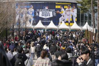 Fans make their way to the stadium prior to the 2024 Seoul Series game between Los Angeles Dodgers and San Diego Padres at Gocheok Sky Dom in Seoul, South Korea, Wednesday, March 20, 2024. (AP Photo/Ahn Young-joon)