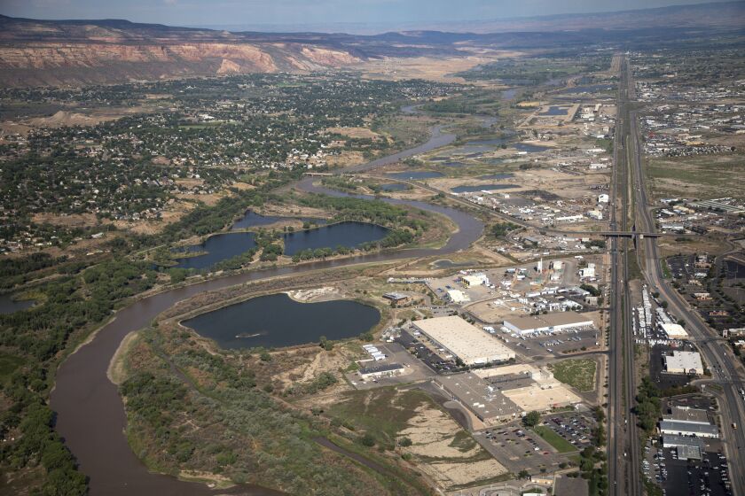 FILE - The Colorado River passes through Grand Junction, Aug. 24, 2022, in Mesa County, Colo. California released a plan Tuesday, Jan. 31, 2023, detailing how western states reliant on the Colorado River could save more water, a day after it was the only state that didn't sign a proposal agreed to by six states in the basin. (Hugh Carey/The Colorado Sun via AP, File)