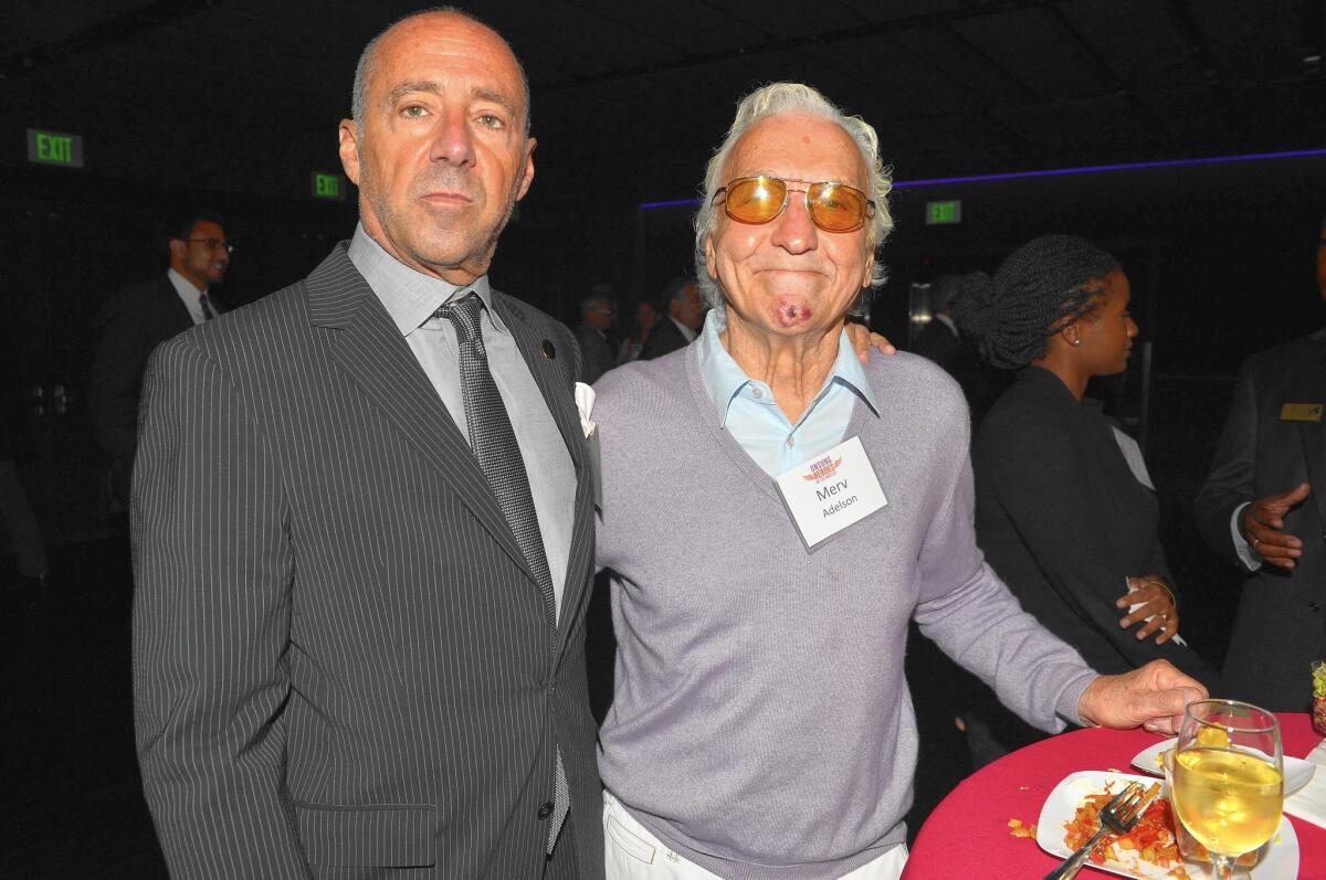 Merv Adelson, right, with Motion Picture & Television Fund Chief Executive Bob Beitcher in 2013, helped found Lorimar Productions in 1969. With hits such as "Dallas" and "Knots Landing," the company launched the prime-time soap opera genre.