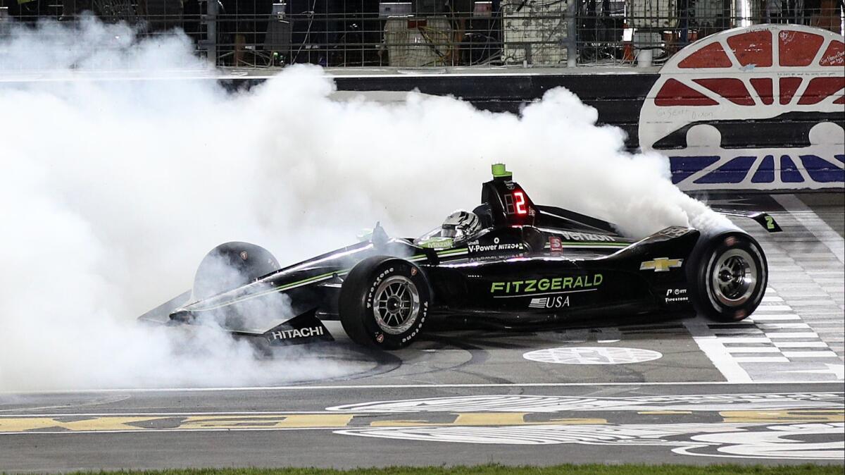 Josef Newgarden celebrates with a burnout after winning at Texas Motor Speedway on June 8.