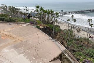 Pieces of a concrete patio have fallen away at Casa Romantica in San Clemente, threatening the railroad tracks below.