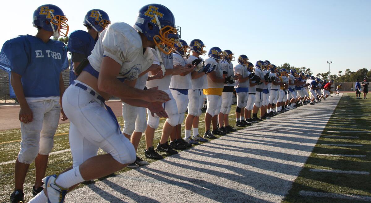 El Toro football players take part in a practice session in September 2012. A new state law prohibits public middle and high schools from holding full-contact football practices that exceed 90 minutes a day.