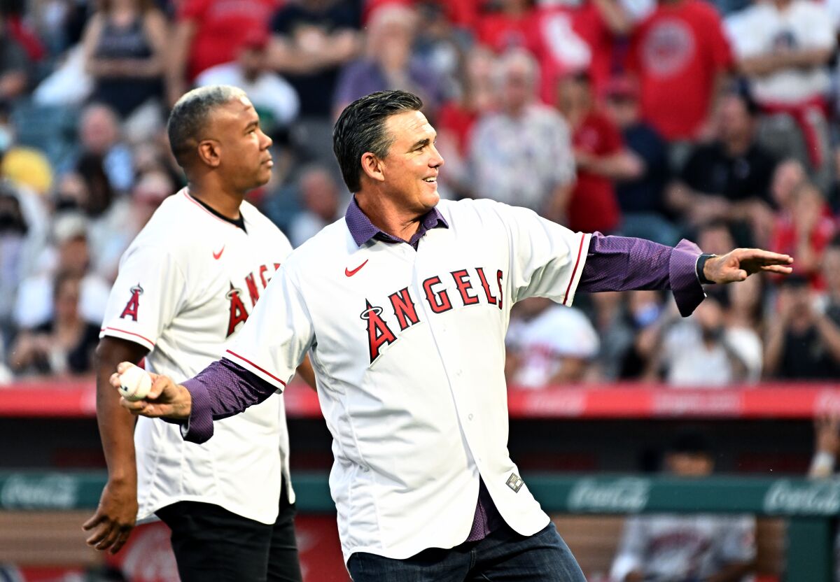 Former Angels Garret Anderson and Tim Salmon throw out the first pitch on opening day at Angel Stadium in April.