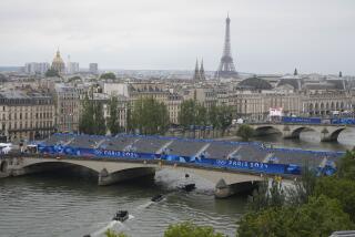 Police boats patrol the Seine river in Paris, France, ahead of the opening ceremony of the 2024 Summer Olympics, Friday, July 26, 2024. (AP Photo/Ricardo Mazalan)
