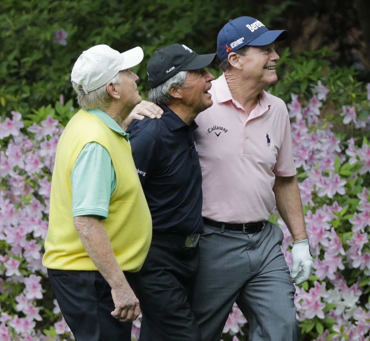 FILE - Jack Nicklaus, left, Gary Player, center, and Tom Watson play together during the par three competition at the Masters golf tournament Wednesday, April 4, 2018, in Augusta, Ga. The Masters said Tuesday, Jan. 11, 2022, that Watson will join them on the tee this year as an honorary starter. (AP Photo/David J. Phillip, File)