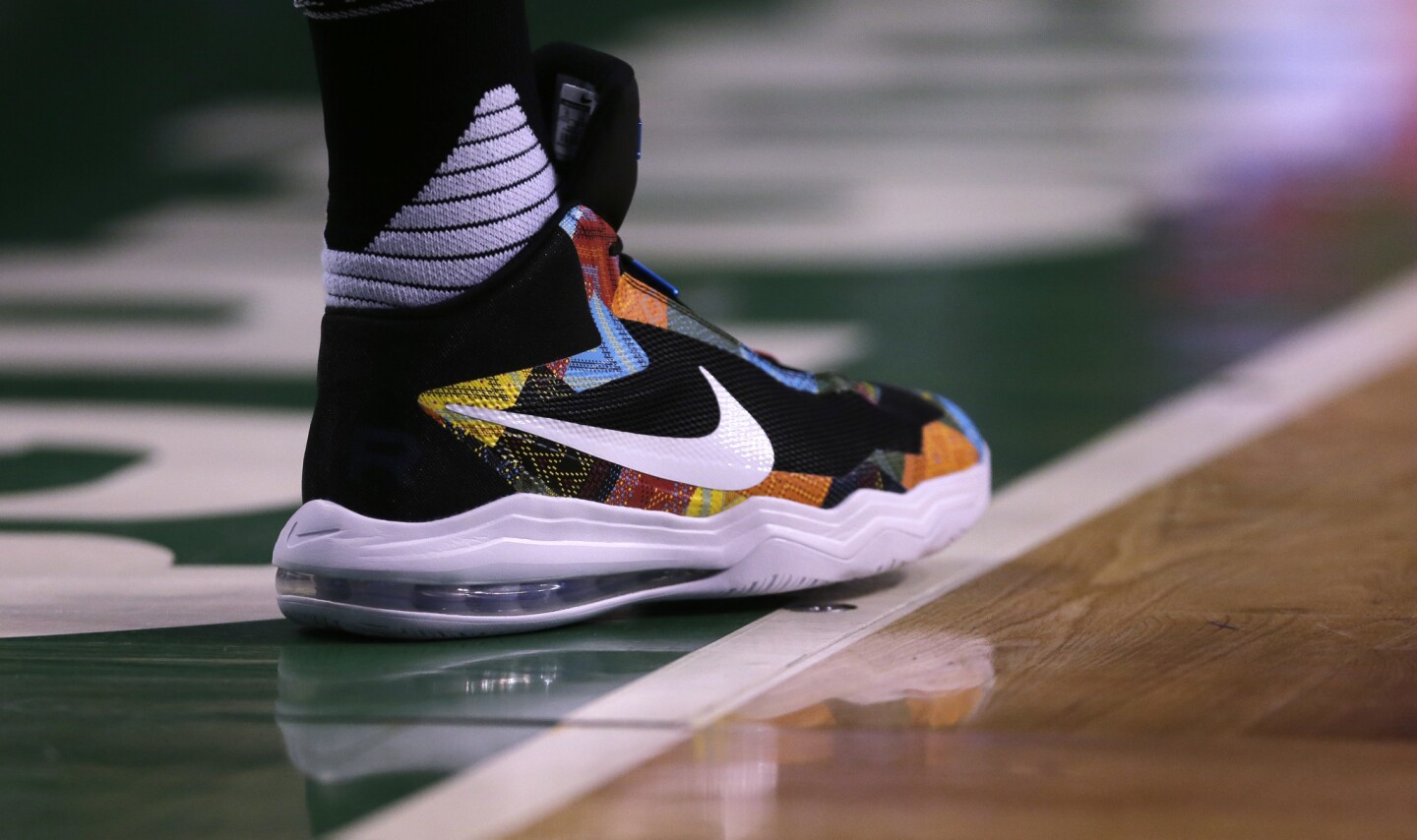 Boston Celtics forward Jonas Jerebko wears colorful Nike shoes during the first quarter of an NBA basketball game in Boston, Wednesday, Feb. 3, 2016. (AP Photo/Charles Krupa)