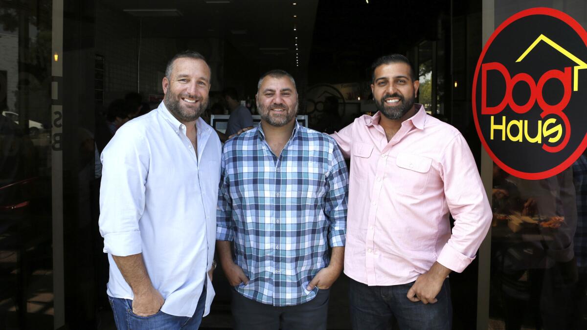 Dog Haus partners Andre Vener, from left, Hagop Giragossian and Quasim Riaz are photographed at Dog Haus in Pasadena.