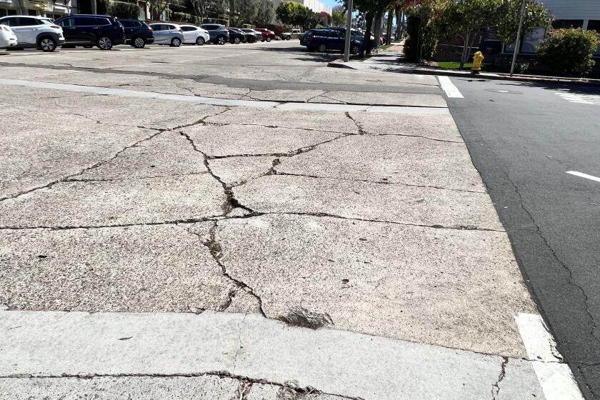 A patchwork of cracked concrete and asphalt on La Jolla streets have some wondering why more of the city's dollars are not spent to fix them.