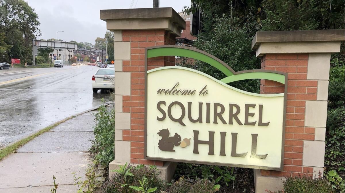 A sign at the entrance to the Squirrel Hill neighborhood near the Tree of Life synagogue after a mass shooting in Pittsburgh.