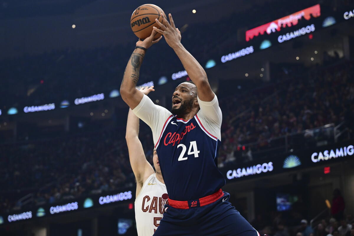 Los Angeles Clippers guard Norman Powell shoots a three point shot.