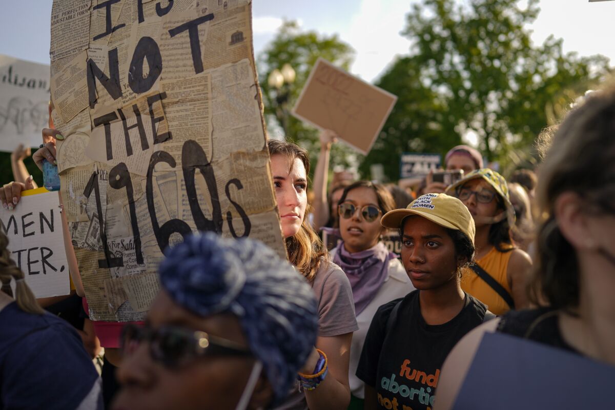 Abortion rights advocates gather outside the Supreme Court on Tuesday.