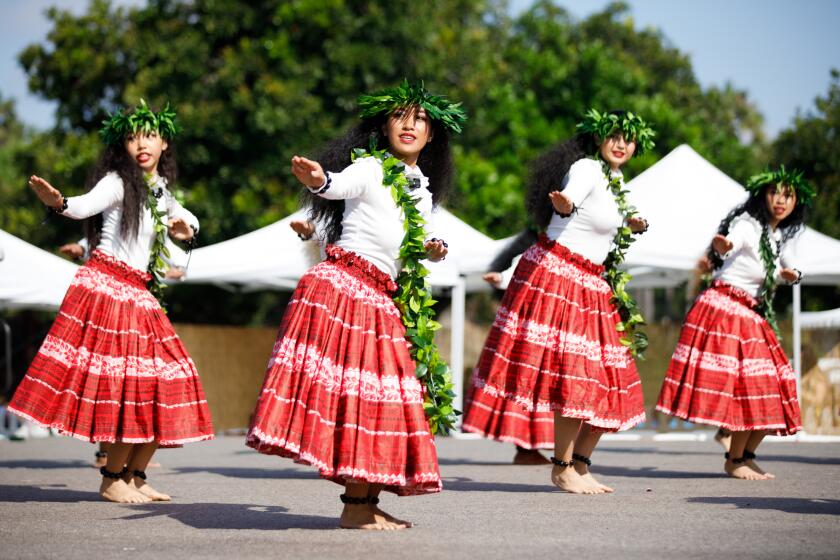 Members of Na Pua “Ilima, a Polynesian dance group, perform onstage during the annual Pacific Islander Festival at Mission Bay’s Ski Beach on Saturday, Sept. 23, 2023.