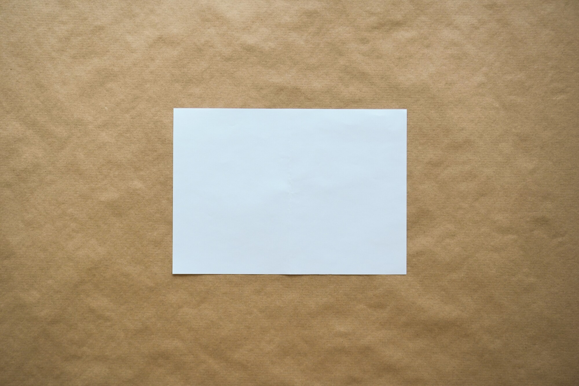 white paper on brown paper background