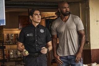 Jose Maria Aguila, left, and Shemar Moore in "S.W.A.T." on CBS.