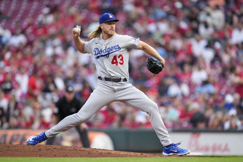 Los Angeles Dodgers starting pitcher Noah Syndergaard throws to a Cincinnati Reds batter during the second inning of a baseball game in Cincinnati, Wednesday, June 7, 2023. (AP Photo/Jeff Dean)
