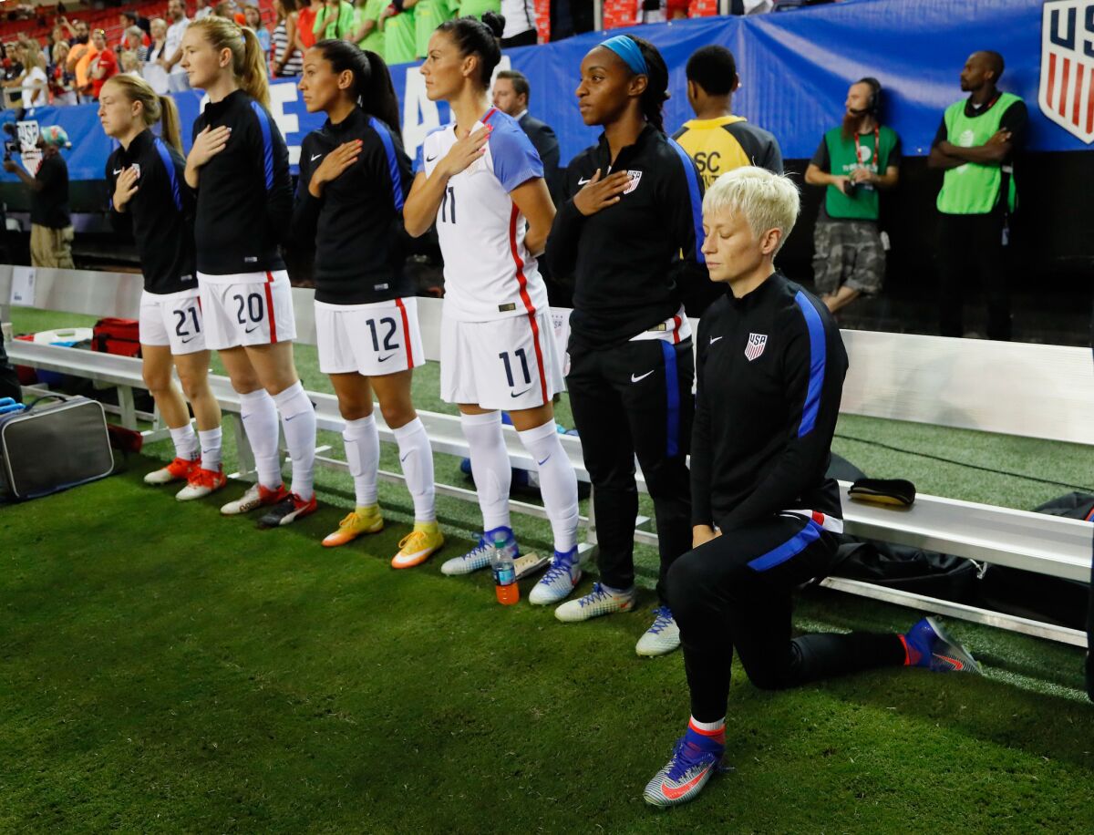 Megan Rapinoe kneels during the national anthem prior to the match between the U.S. and the Netherlands at Georgia Dome on Sept. 18, 2016, in Atlanta.