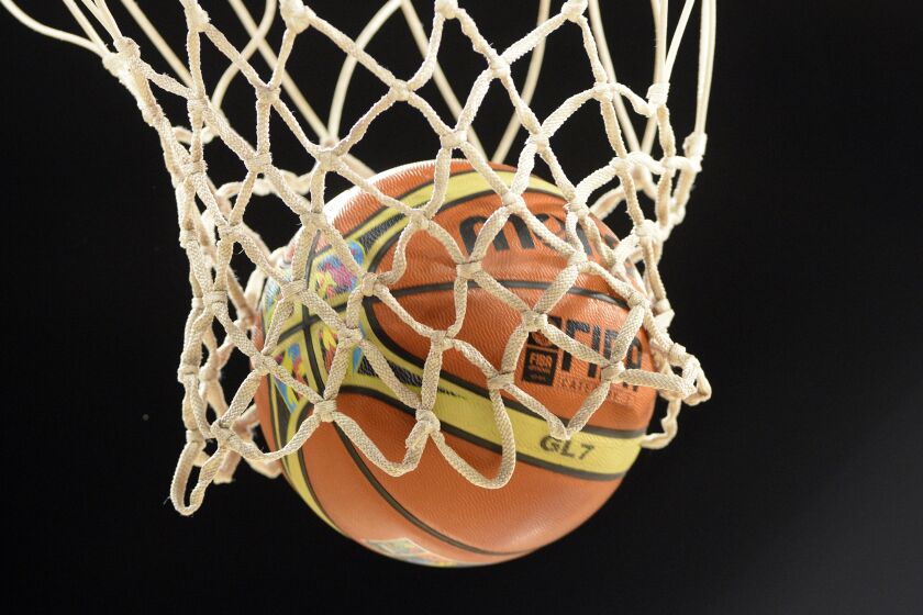 A picture taken on August 30, 2014 shows an official ball of the 2014 FIBA World basketball championships in the net at the Gran Canaria Arena in Gran Canaria. AFP PHOTO / GERARD JULIEN (Photo credit should read GERARD JULIEN,GERARD JULIEN/AFP via Getty Images)