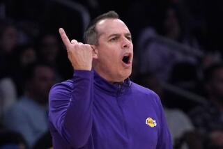 Los Angeles Lakers head coach Frank Vogel gestures during the second half of an NBA basketball game