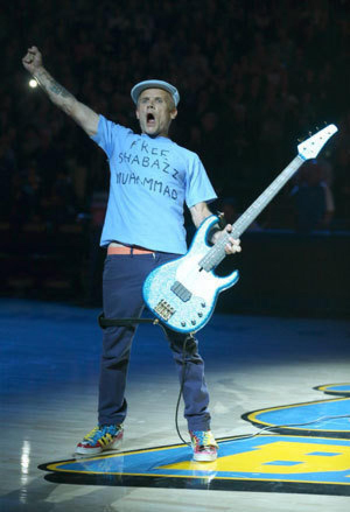 Flea wears a "Free Shabazz" T-Shirt while performing the national anthem before the start of the UCLA-Indiana State game.