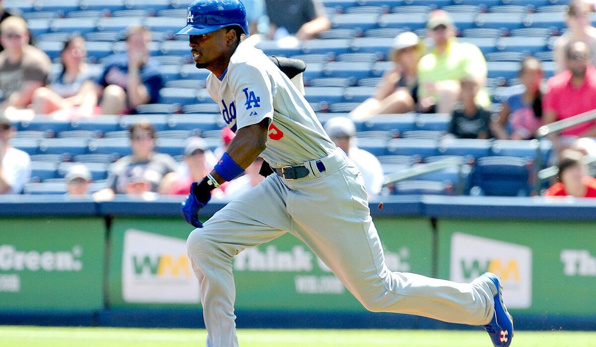 Dodgers second baseman Dee Gordon heads toward second base during a successful steal attempt in the first inning against the Braves on Thursday afternoon in Atlanta.