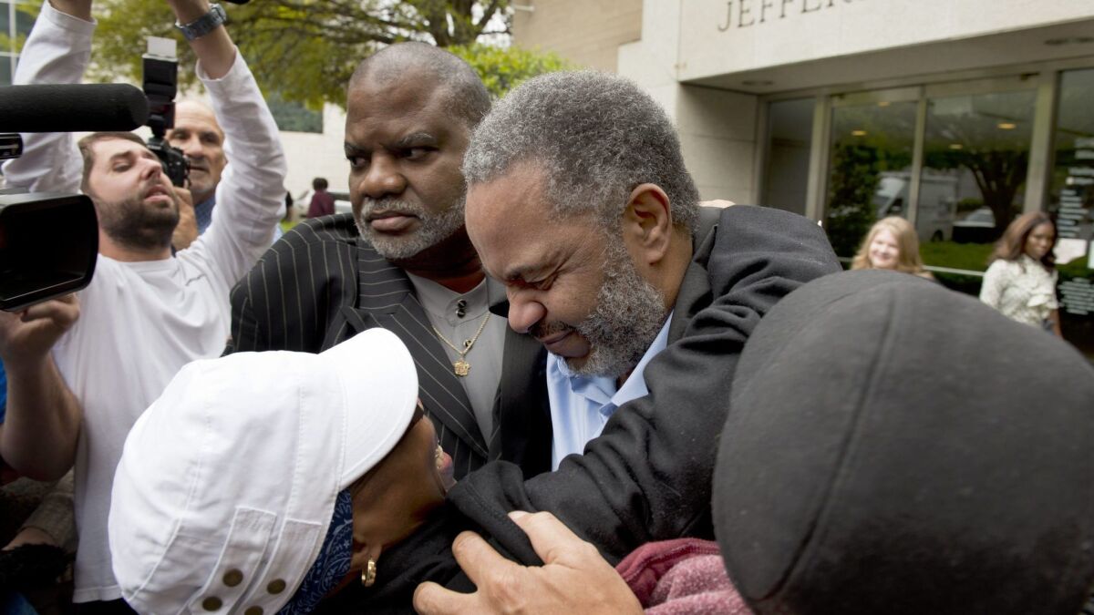 Anthony Ray Hinton, center, when he was released from prison in 2015.