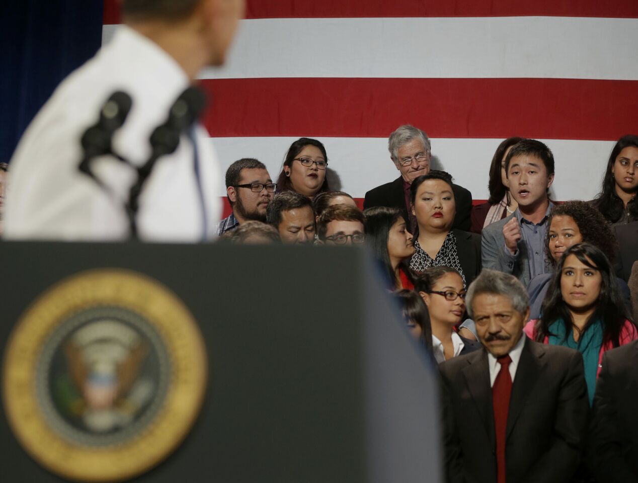 President Obama turns around to respond to a man who was heckling him about anti-deportation policies.