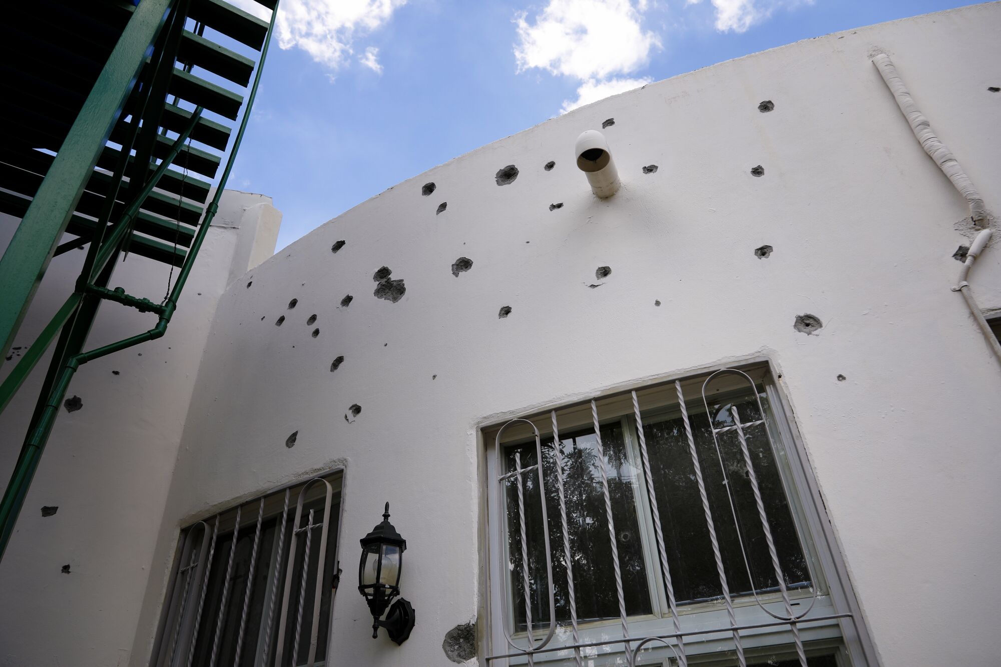 Bullet holes riddle the sides and glass windows of the chapel at Parroquia Jesus de la Divina Misericordia, a Catholic church in Managua where student protesters took refuge in July 2018. The church has consciously preserved these signs of repression.