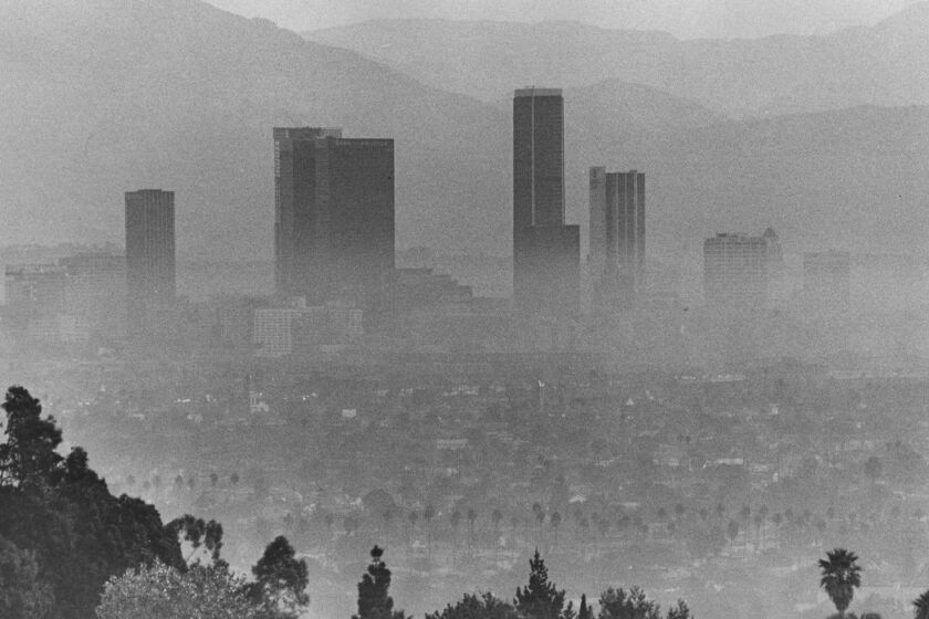 Downtown Los Angeles' tallest buildings rise above a blanket of smog in October 1973.