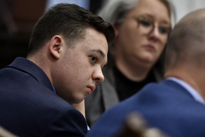 Kyle Rittenhouse, left, listens as his attorney Mark Richards gives his closing argument during Rittenhouse's trial at the Kenosha County Courthouse in Kenosha, Wis., on Monday, Nov. 15, 2021. Rittenhouse, an aspiring police officer, shot two people to death and wounded a third during a night of anti-racism protests in Kenosha in 2020. (Sean Krajacic/The Kenosha News via AP, Pool)
