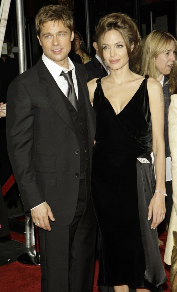 Angelina Jolie and Brad Pitt arrive at the New York premiere of "A Mighty Heart" on June, 13, 2007.