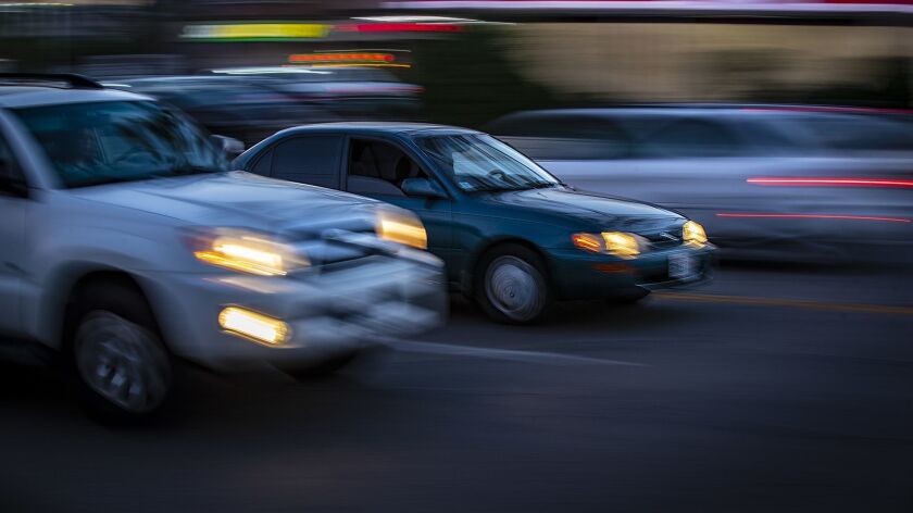The Insurance Institute for Highway Safety has found that only a little more than half of new cars have adequate lighting systems. Above, cars drive at dusk.