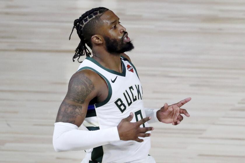 Milwaukee Bucks guard Wesley Matthews (9) reacts after making a 3-point basket against the Orlando Magic.