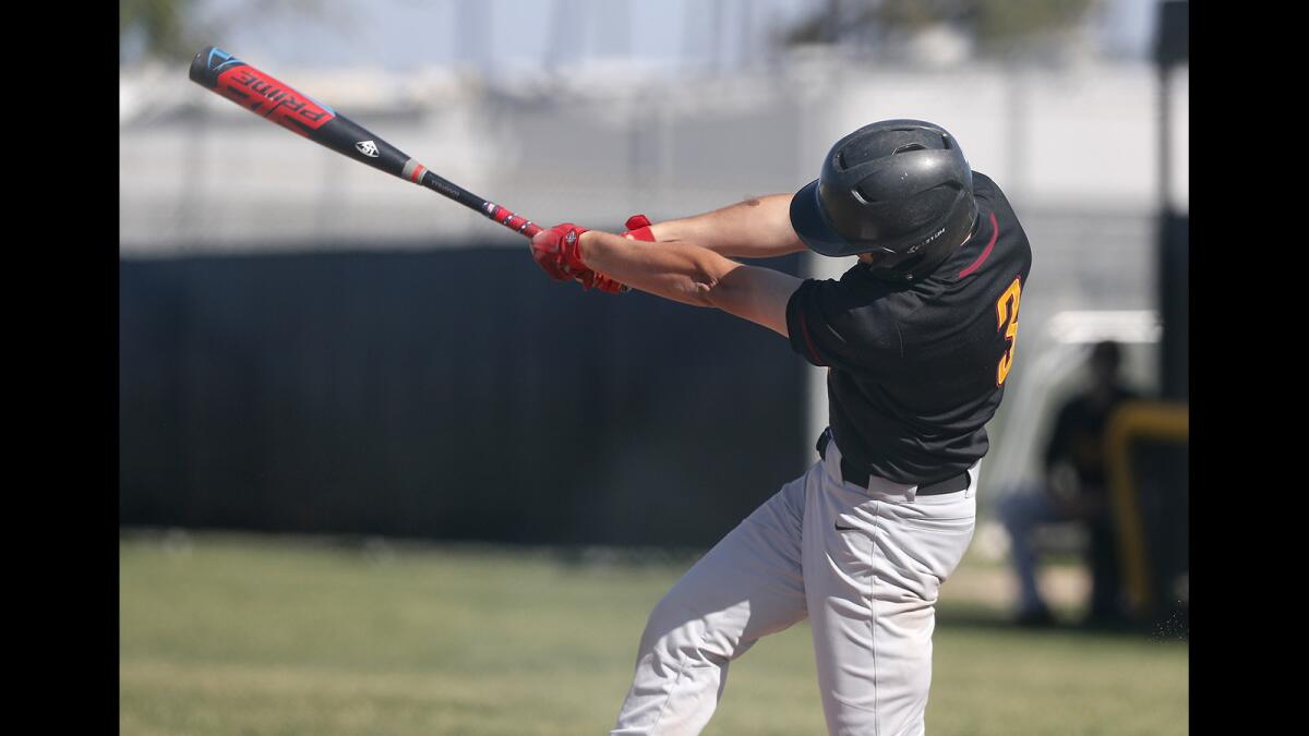 Estancia High's Garrett Palme drives in two runs on a double in the third inning of an Orange Coast League game at Costa Mesa on Tuesday.